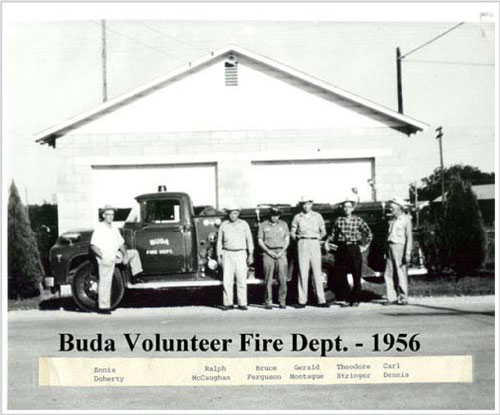 Men standing with fire truck in 1956