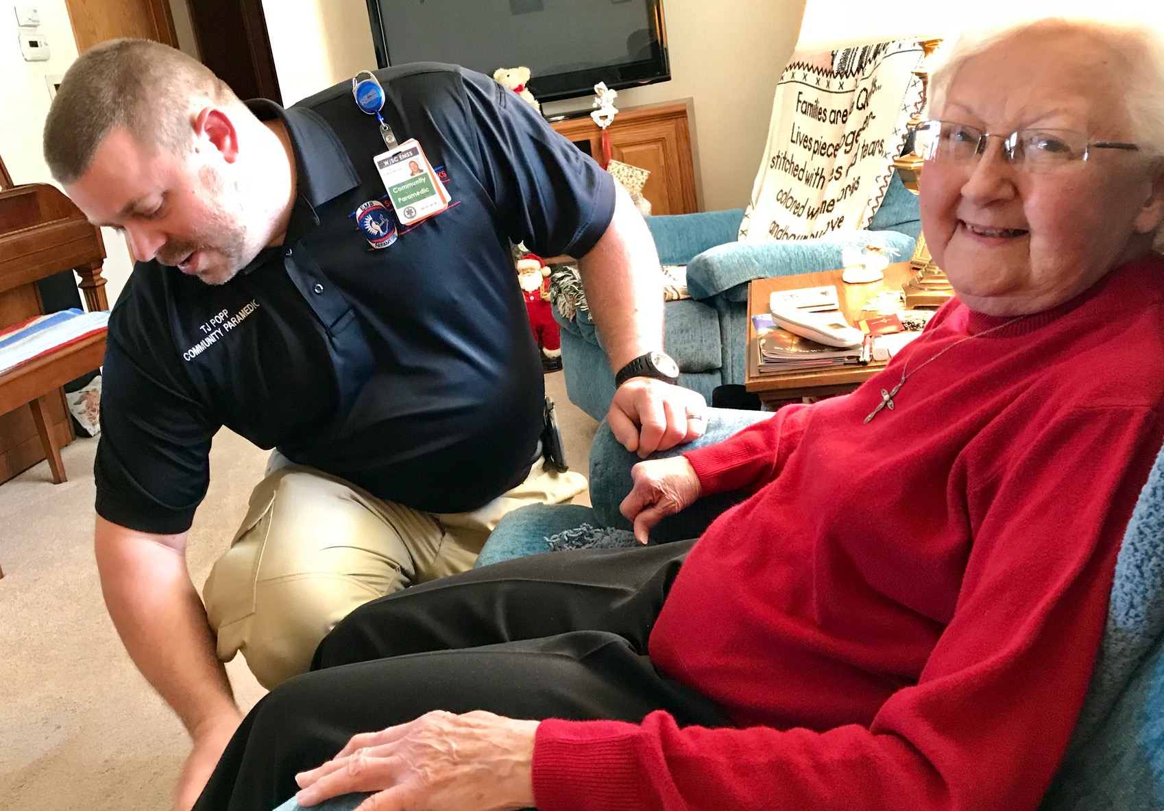 Man helping elderly woman